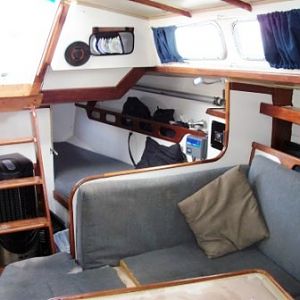 qtr berth after paint & varnish, etc (showing original upholstery before I created custom slip-covers for all cushions).  Note: I moved companionway s